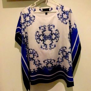 White and blue patterned blouse